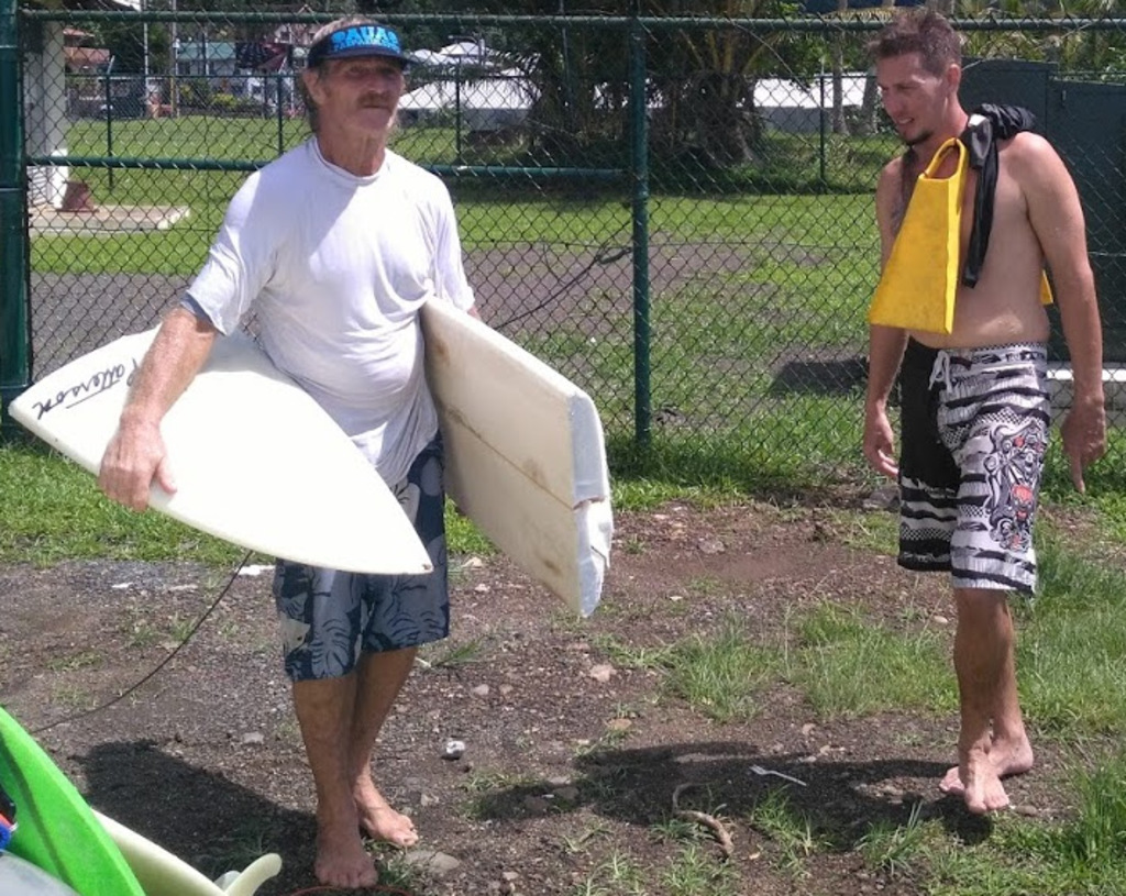 Pictured: Roach and Don after a heavy surf session. Roach holding his Favorite broken T.Patterson Surfboard.